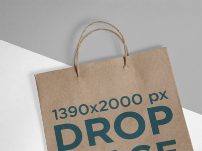 Closeup Mockup of a Paper Bag Lying on a Multicolor Surface