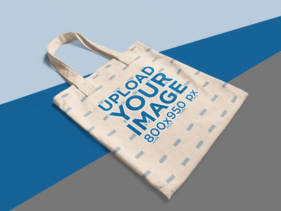 Angled Mockup of a Tote Bag Lying on a Multicolor Surface a15311