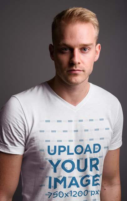 V-Neck T-Shirt Mockup of a Young Man at a Studio