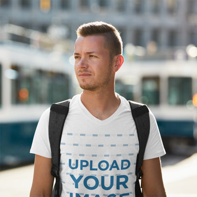 T-Shirt Mockup Featuring a Backpacker at a Train Station