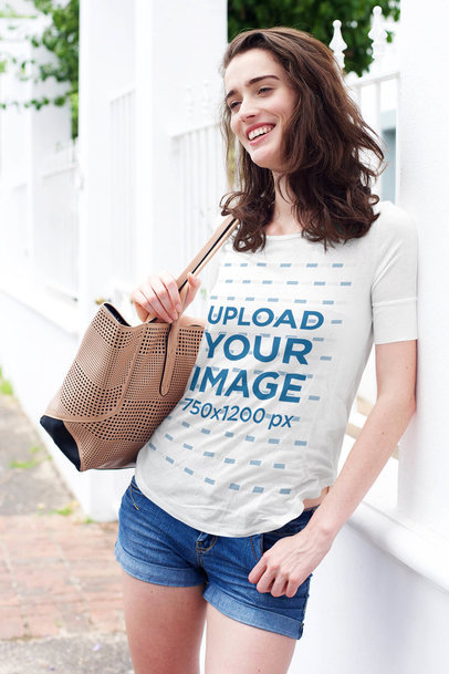 T-Shirt Mockup of a Happy Young Woman in a Summer Outfit