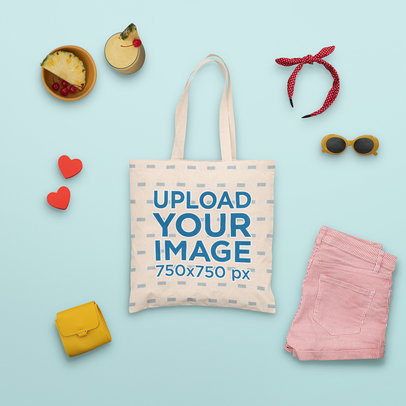 Mockup of a Tote Bag Surrounded by Summer Accessories and a Tropical Drink m1662