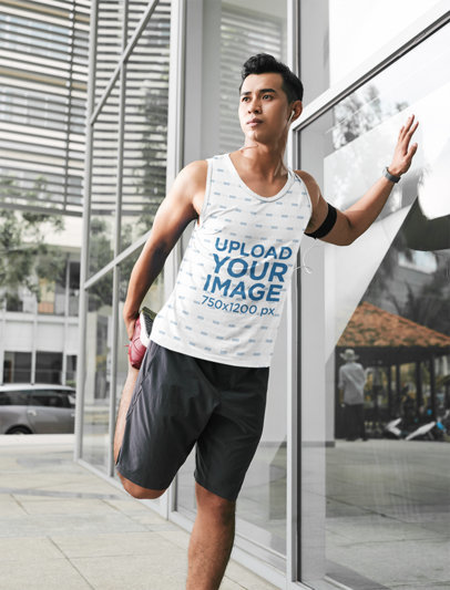Tank Top Mockup of an Athlete Stretching His Leg Before Running Through the City 42052-r-el2