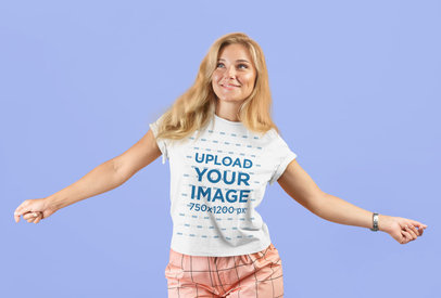 Unisex T-Shirt Mockup of a Happy Young Woman at a Studio 
