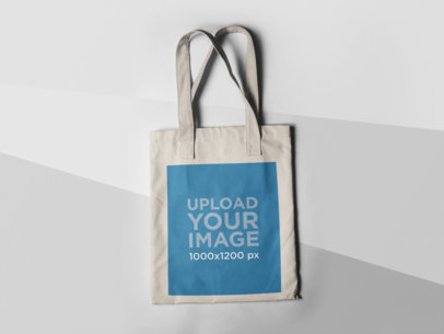 Tote Bag Mockup Lying on a Three Colors Surface