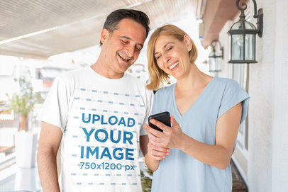 T-Shirt Mockup of a Man with a Woman Watching a Mobile Phone 44452-r-el2