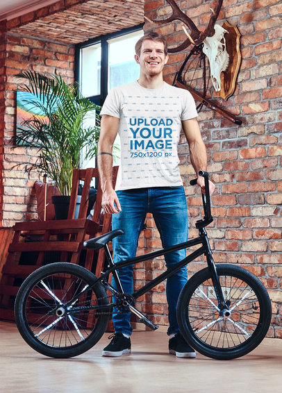 T-Shirt Mockup of a Man Posing by an Acrobatic Bicycle 43164-r-el2