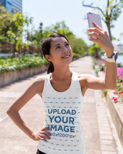 Tank Top Mockup of a Female Runner Taking a Selfie