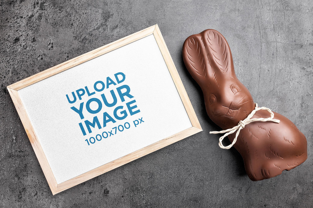 Mockup of an Art Print Placed Next to a Chocolate Bunny