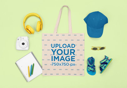 Mockup of a Tote Bag with Kid's Items for a Summer Trip