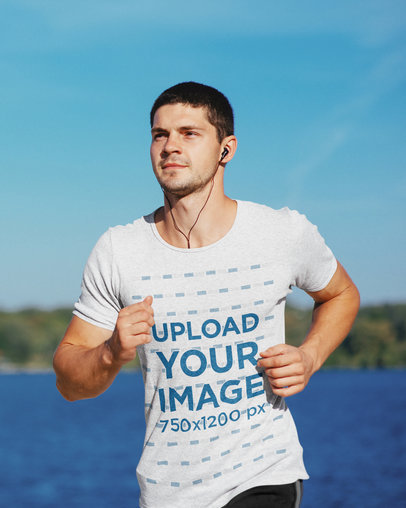 T-Shirt Mockup of a Young Man Running by a Lake 