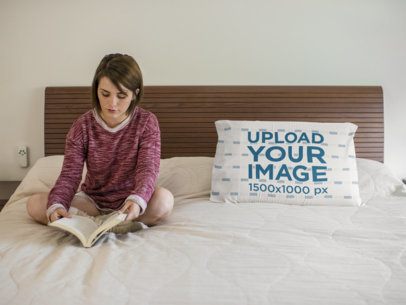 Young Pretty Woman Reading While Sitting on her Bed Near to a Pillow Template
