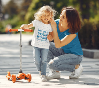 T-Shirt Mockup of a Happy Girl With a Scooter Standing by Her Mom 41557-r-el2