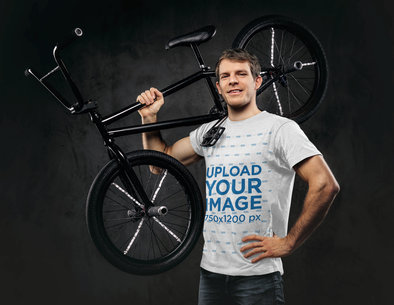 T-Shirt Mockup of a Man Holding a Sports Bike