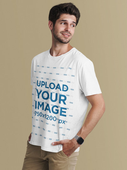 T-Shirt Mockup of a Relaxed Man Posing in a Studio