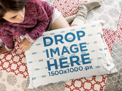Top Shot of a Young Woman Holding a Pillow While Sitting Down on the Floor