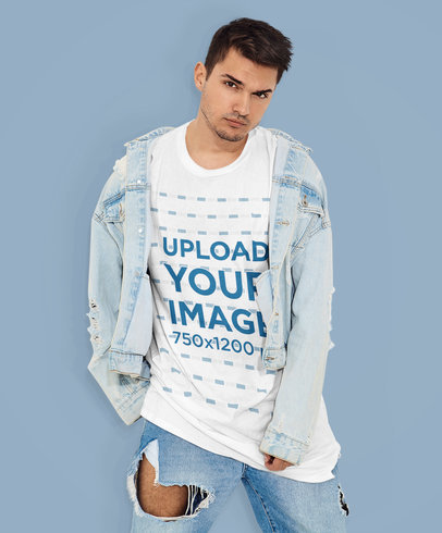 Mockup of a Young Man Posing with a Round-Neck Tee at a Studio