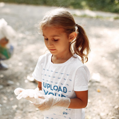 T-Shirt Mockup of a Little Girl Wearing Plastic Gloves 41553-r-el2