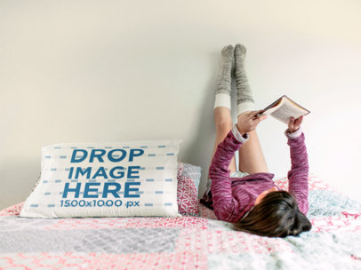 Young Girl Reading Upside Down Near to a Pillow Mockup a14939