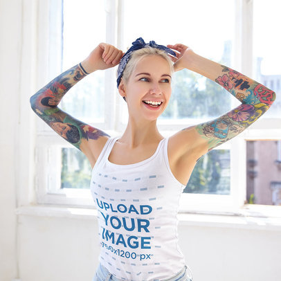Tank Top Mockup Featuring a  Joyful Woman With Arm Tattoos Wearing a Tank Top