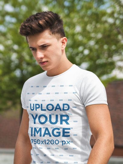 T-Shirt Mockup of a Thoughtful Young Man 