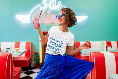 Basic T-Shirt Mockup of a Happy Woman Holding a Milkshake 