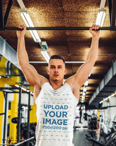 Tank Top Mockup of a Muscular Man Doing Pull-Ups at the Gym