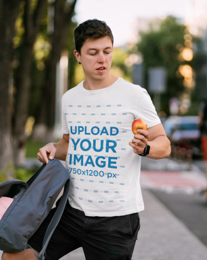 T-Shirt Mockup of a College Student Eating an Apple