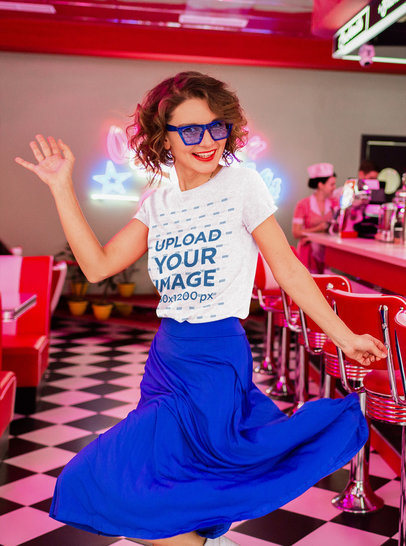 Heather T-Shirt Mockup of a Happy Woman Dancing at a Retro Diner 