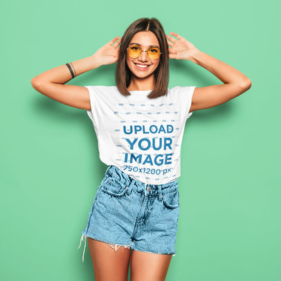 T-Shirt Mockup of a Stylish Young Woman in a Summer Outfit 