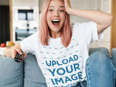 T-Shirt Mockup Featuring a Surprised Woman at Home 
