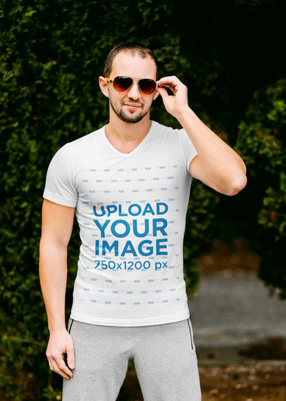 V-Neck T-Shirt Mockup of a Man Wearing an Athleisure Look and Sunglasses