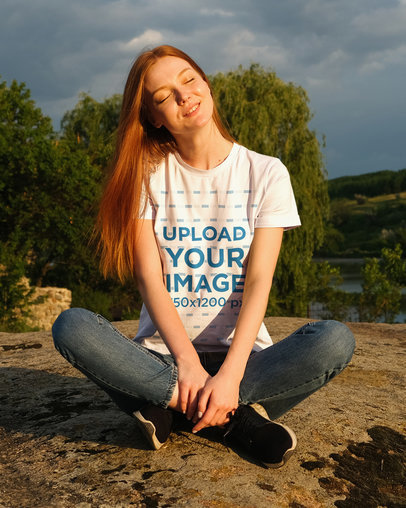 T-Shirt Mockup of a Woman Enjoying Nature 