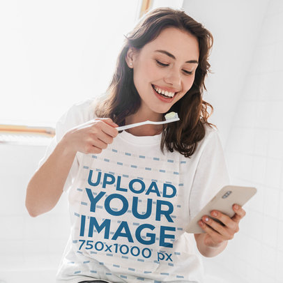 Unisex T-Shirt Mockup of a Happy Woman Holding a Toothbrush 