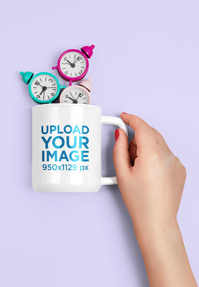 Mockup Featuring a Woman's Hand Holding an 11 oz Coffee Mug With Tiny Alarm Clocks 