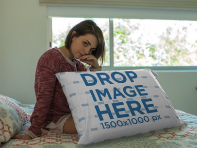 Young Woman Sitting Down on her Bed Near a Big Pillow Template