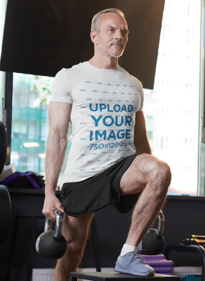 T-Shirt Mockup of a Middle-Aged Man Working Out at the Gym