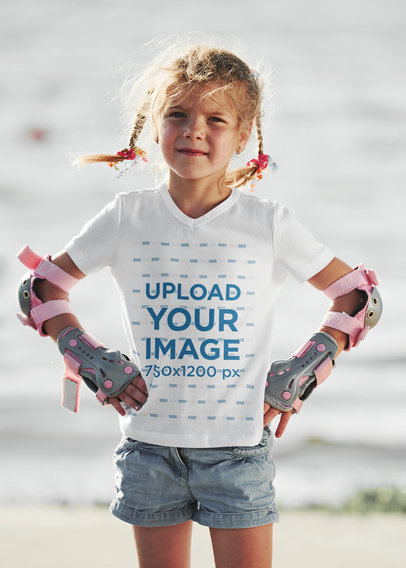 V-Neck Tee Mockup of a Little Girl with Skating Protective Gear