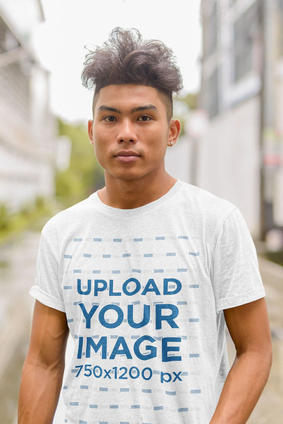 Heathered T-Shirt Mockup Featuring a Serious Man Posing