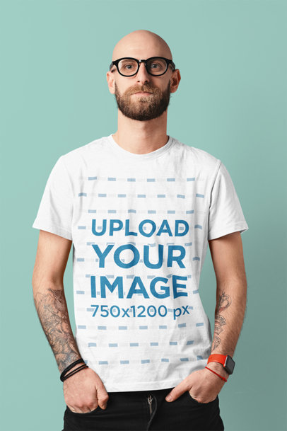 Basic T-Shirt Mockup of a Tattooed Man Posing With His Hands in His Pockets 