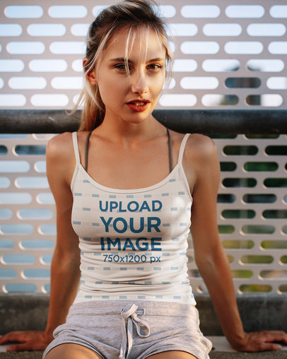Mockup Featuring a Young Woman Posing in a Sublimated Tank Top