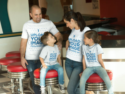 Family of Four Wearing Different T-Shirts Mockup From One Another Having Fun in a Burgers Restaurant