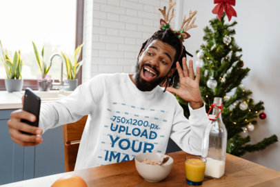 Sweatshirt Mockup of a Man Taking a Selfie During Breakfast on Christmas