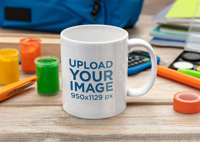 Mockup of an 11 oz Coffee Mug on an Art Table