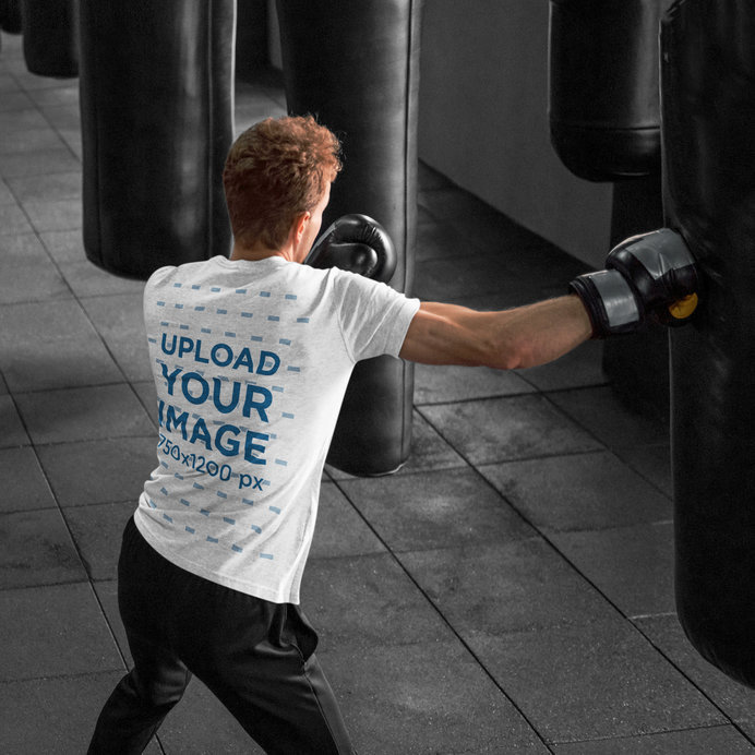 Heather T-Shirt Mockup of a Red-Haired Man Boxing in a Gym