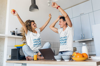 T-Shirt Mockup of a Man and a Woman Having Fun in the Kitchen