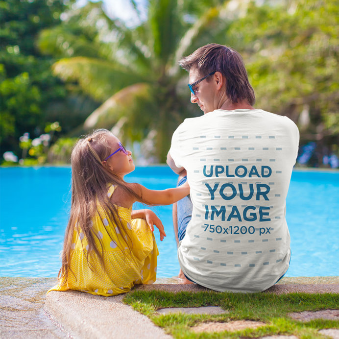 Back-View T-Shirt Mockup of a Man Sitting by a Pool with His Daughter