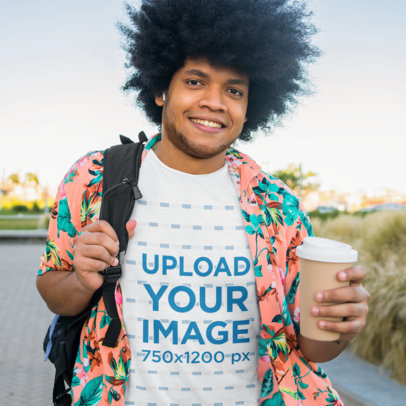 T-Shirt Mockup Featuring a Man with Natural Hair Holding a Drink