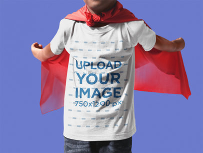 Little Kid with Cropped Face Wearing a Round Neck T-Shirt Mockup and a Red Cloak While Standing Against a Transparent Backdrop
