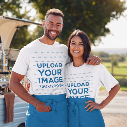 T-Shirt Mockup of a Happy Couple at an Outdoor Bazar